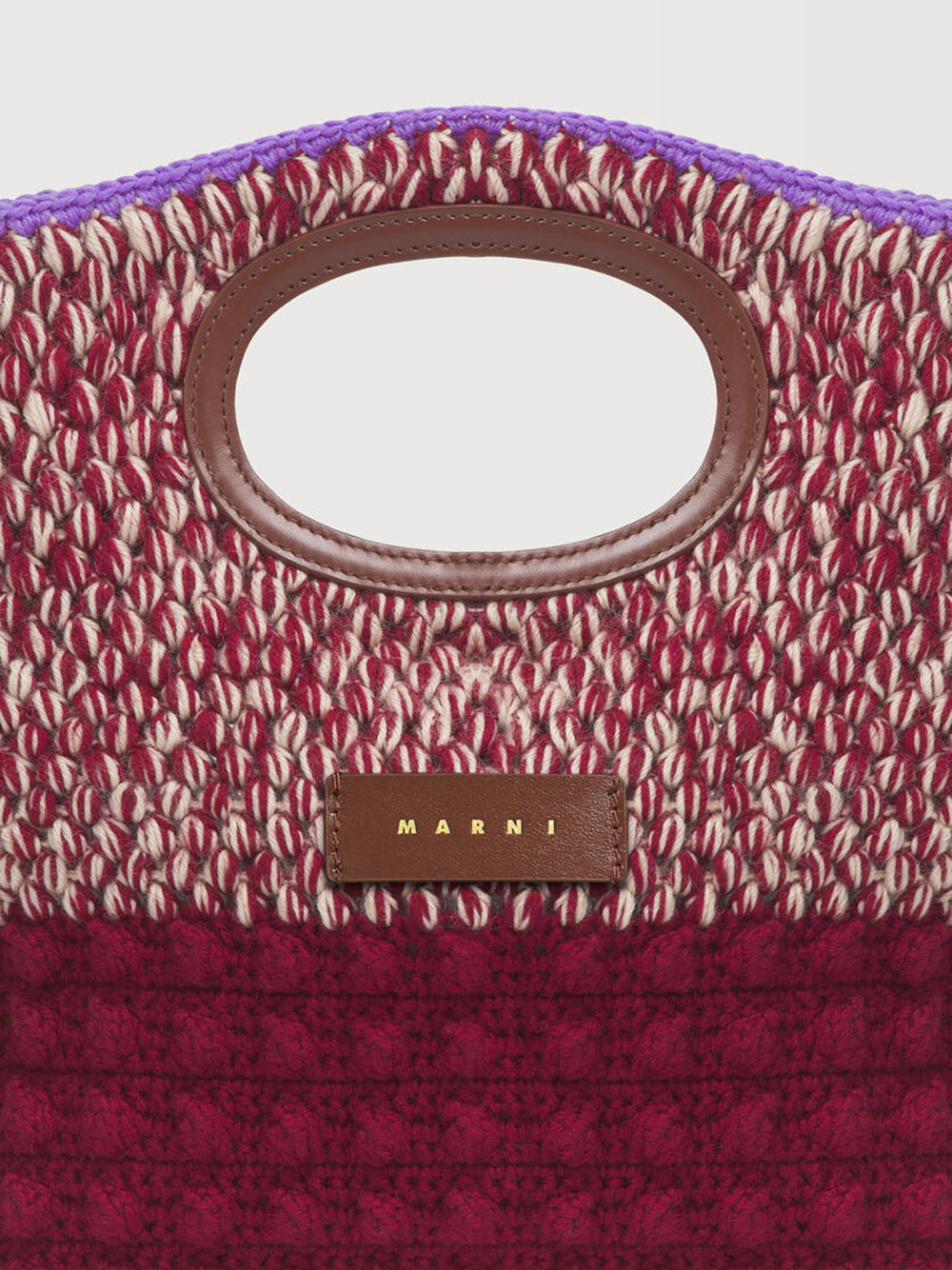 Knotty clutch in red crochet wool